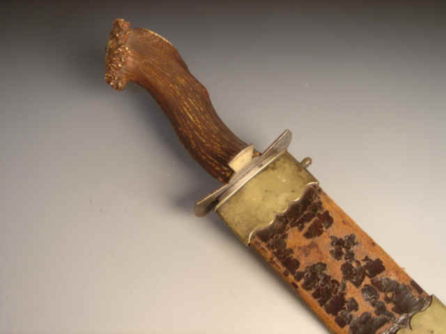 Important and Rare Massive Etched Blade Early Bowie Knife, with Inscription ''George Young His Dagger 1825,'' with Brass-Mounted Blind-Tooled Leather Scabbard, the Blade Signed S.E., ca.1825