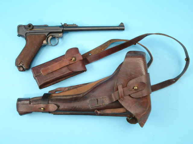 *German DWM Artillery Model P-08 Parabellum Semiautomatic Pistol , together with Holster and Wooden Carbine Shoulder Stock *German DWM Artillery Model P-08 Parabellum Semiautomatic Pistol , together with Holster and Wooden Carbine Shoulder Stock