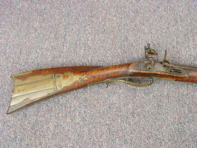 An Elegant Flintlock Kentucky Rifle by S. Miller, with Brass Patchbox and Incised Carving, c. 1800-05