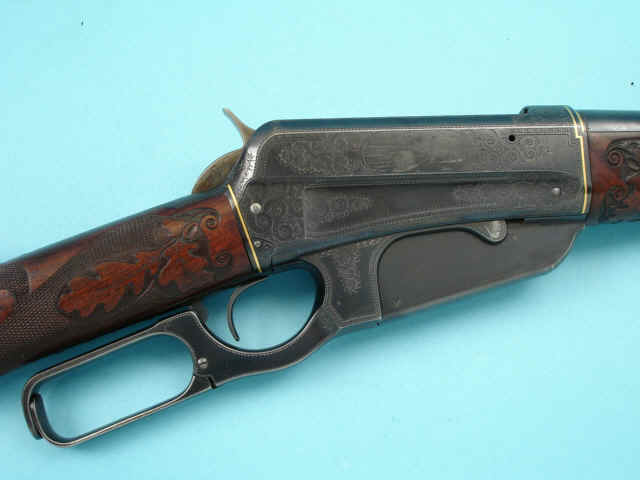 *Engraved and Gold Inlaid Winchester Model 1895 Lever Action Sporting Rifle, with Carved and Checkered Select Walnut Stocks