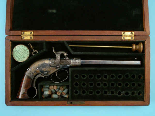 Rare and Fine Cased Exhibition Quality Engraved Serial No. 1 W.W. Marston Breechloading Pistol with Octagonal Barrel, Engraved by L.D. Nimschke Rare and Fine Cased Exhibition Quality Engraved Serial No. 1 W.W. Marston Breechloading Pistol with Octagonal Barrel, Engraved by L.D. Nimschke