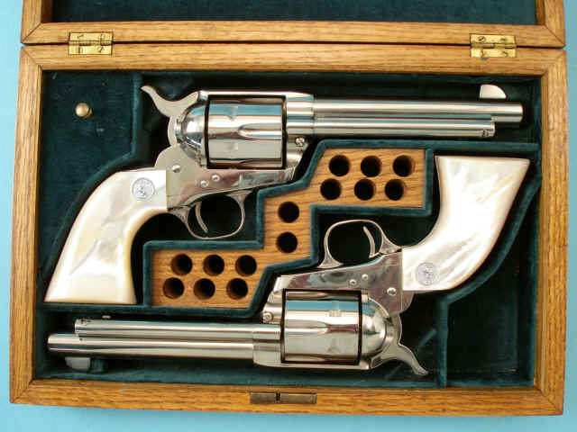 **Cased and Matched Pair of Colt Single Action Post World War II Revolvers with Pearl Grips