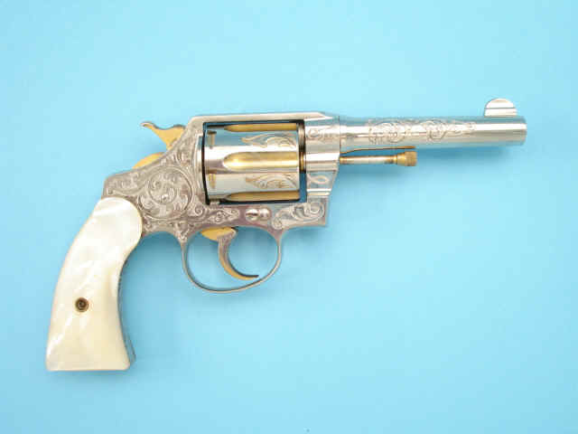 *Fine and Scarce Cuno Helfricht Engraved and Gold- and Nickel-Plated Colt Police Positive Revolver, with Pearl Grips