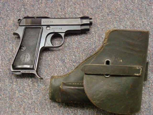 *Beretta Model 1934 Semi-Automatic Pistol with Extra Magazine and Black Leather Holster *Beretta Model 1934 Semi-Automatic Pistol with Extra Magazine and Black Leather Holster
