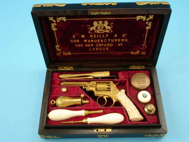 Very Fine Cased Elaborate Exhibition Engraved Gold Finished Adams-Beaumont Patent Percussion Revolver by E. M. Reilly & Co., London, No. 42304, c. 1855